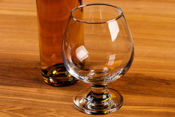 Glass of cognac and a bottle