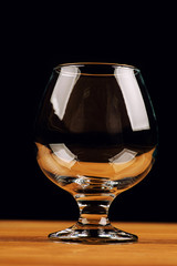 glass for cognac on black background