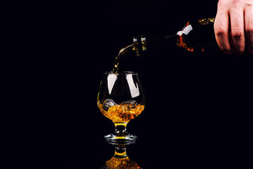glass for cognac on black background