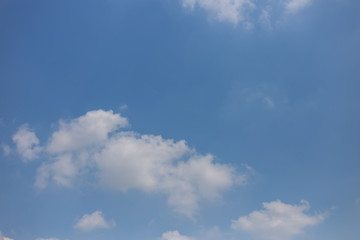 The sky is blue and the clouds are white.