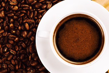 Cup of coffee and roasted coffee beans