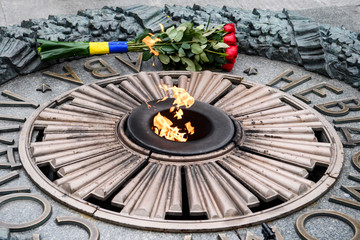 Bouquet of roses near the Eternal fire on the Tomb of the Unknown Soldier in Kyiv, Ukraine, 09 May 2019.