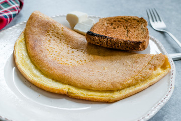 Fluffy Omelette Homemade Mont Saint Michel Style with Toast Bread and Cheese for Breakfast