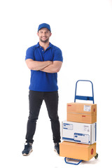 Delivery man in blue uniform of delivery service with trolley, online shopping delivery concept