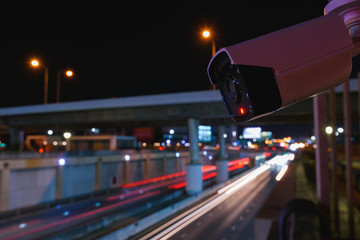 Fototapeta premium CCTV surveillance camera operating on traffic road
