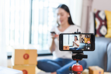 Beauty blogger demonstrating how to make up and review products on live broadcast use smartphone, life of an influencer