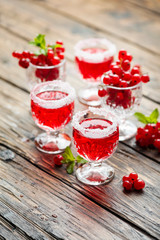 Red currant liquor with sugar and mint