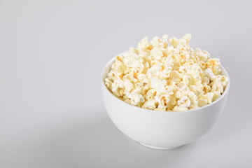 Bowl with popcorn. Isolated on white background.