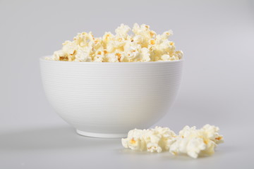 Isolated Caramel popcorn in white bowl.