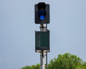 Semaphore with burning blue signal light