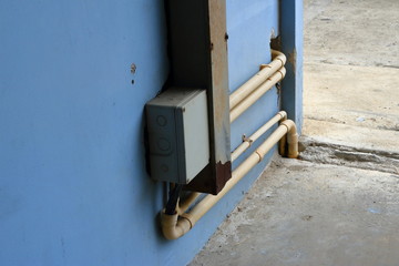 Closeup of junction box and wire way connected to electrical pipes for power distribution, connection concept