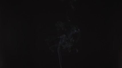 Obraz premium Emergence of a thin stream of smoke or steam vape. Cigarette smoke, beautiful and high-quality background animation