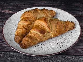 lush croissants made from gluten-free flour and butter, fresh pastries, delicious, on a wooden background