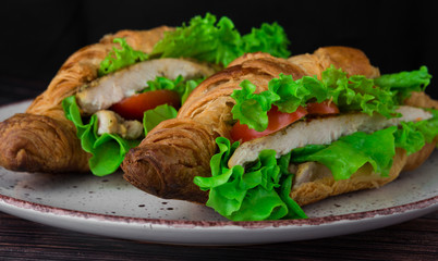 lush croissants stuffed with cherry tomatoes, fresh herbs, chicken fillet in spices, gluten free flour