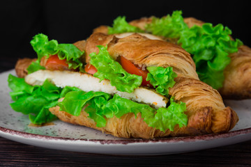 lush croissants stuffed with cherry tomatoes, fresh herbs, chicken fillet in spices, gluten free flour