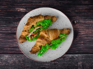 lush croissants stuffed with cherry tomatoes, fresh herbs, chicken fillet in spices, gluten free flour