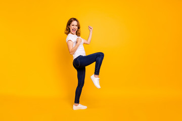 Fototapeta na wymiar Full length body size view photo nice lovely people shout yeah free time weekend summer travel fortune luck celebrate content delighted raise fists modern denim clothes isolated yellow background