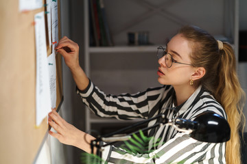 Confident pretty young businesswoman working
