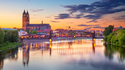 Magdeburg, Germany. Cityscape image of Magdeburg, Germany with reflection of the city in the Elbe river, during sunset. - obrazy, fototapety, plakaty
