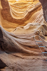 Israel. The neighborhood of Eilat. Red canyon. Ladder for descent into the cleft