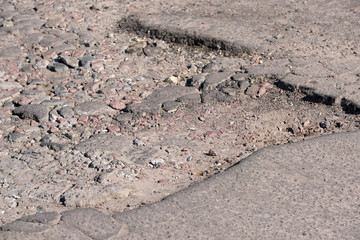 Destroyed asphalt pavement