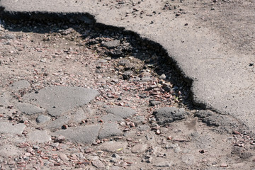 Destroyed asphalt pavement