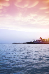 Obraz premium Sunset on Nissi Beach in Ayia Napa, Cyprus, Mediterranean Sea. Sea beach relax, outdoor travel