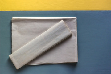 blank newspapers on blue and yellow background