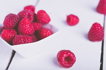 Raspberries on a bowl on a table