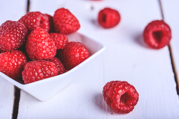 Raspberries on a bowl on a table