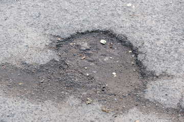 Destroyed asphalt pavement
