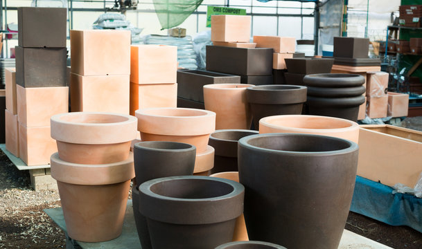 Image of rows with clay pots for flowers