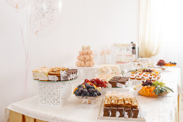 Delicious sweet buffet with cupcakes. Candy Bar.
