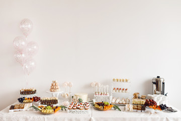 Delicious sweet buffet with cupcakes. Candy Bar.
