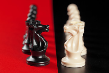 Chess business success, leadership concept. Red background.