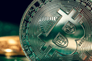 golden bitcoin and computer chip in background