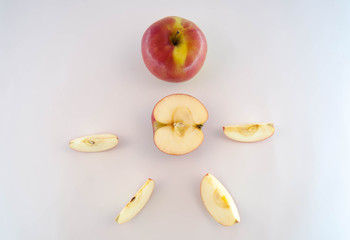 Slices of fresh red apple isolated on white background