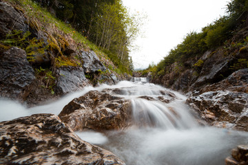 Waterfall in Logar Valley between snowy mountains forest in Spring vacation tourist, Logarska dolina, Slovenia&nbsp;