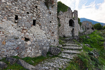 Fototapeta na wymiar Part of the byzantine archaeological site of Mystras in Peloponnese, Greece. View of the remains of buildings in the upper city of the ancient Mystras