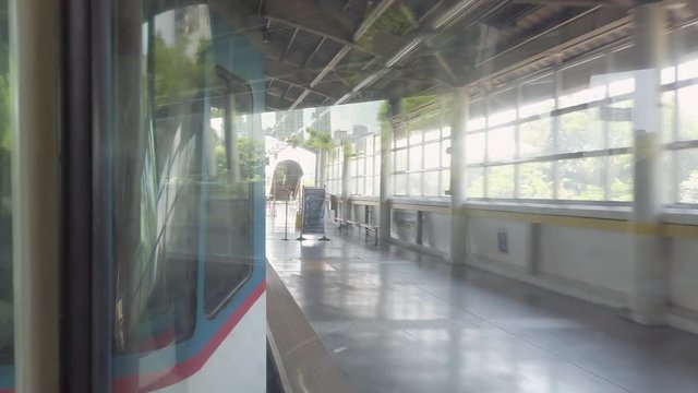 Inside a fast moving MRT leaving the platform in Manila