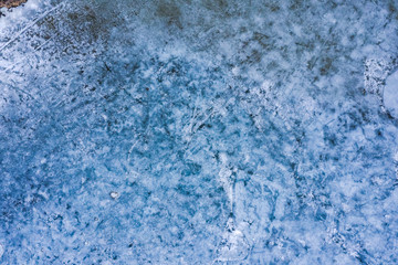 Fototapeta na wymiar Aerial view of frozen lake. Drone view. Background texture concept.