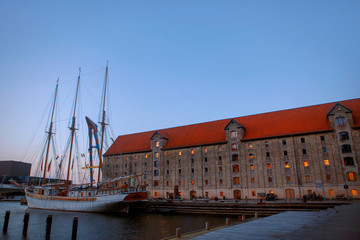 wooden ship moored on water canal in Copenhagen 