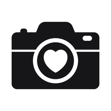 Camera with heart on white background icon
