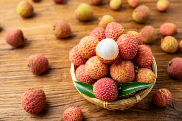 Summer delicious fruit fresh lychee on wooden table