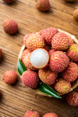 Summer delicious fruit fresh lychee on wooden table