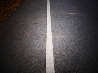 asphalt road with lines