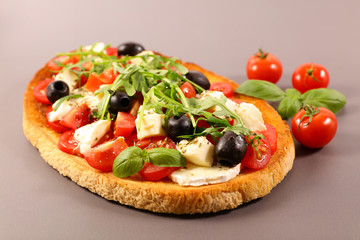 bread toasted with tomato, mozzarella and basil- italian bruschetta