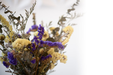 Beautiful dried flowers bouquet over white background