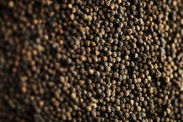 black, white, red peppercorns spice. Closeup Background