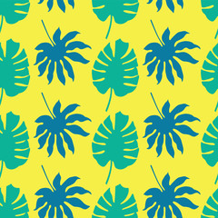 Fototapeta na wymiar Vector seamless pattern background with green and blue tropical leaves on neon yellow background